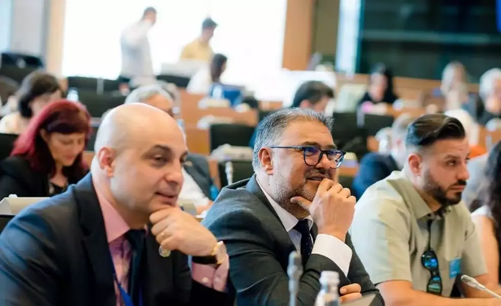 Business meeting with attentive participants in conference room.