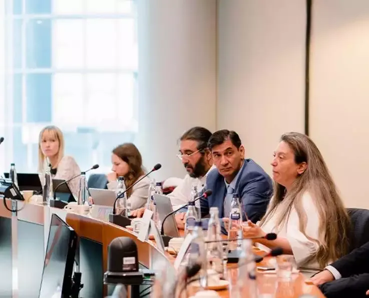 People having discussion at a conference table